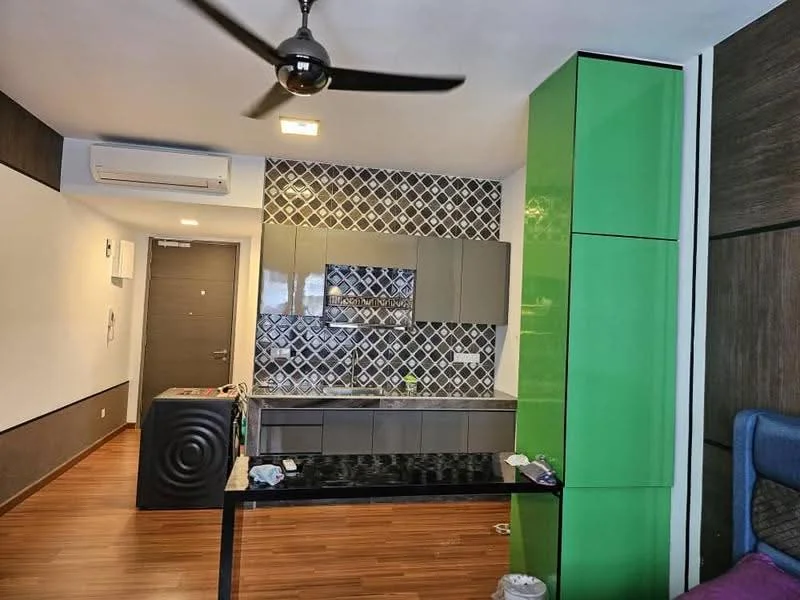 Kitchen features: green cabinetry, grey cabinetry, black countertop, wall-mounted air conditioning unit, 5-blade ceiling fan, decorative backsplash with geometric pattern, built-in oven, stainless-steel sink, kitchen island, wooden flooring; style: modern.