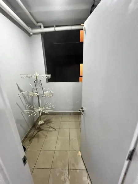 Room features: white painted walls, tile flooring, clothes drying rack, window with dark view, exposed pipes.