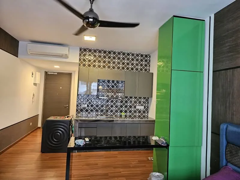 Kitchen features: green high-gloss cabinetry, grey lower cabinetry, black countertop, wall-mounted kitchen cabinets, geometric patterned backsplash, stainless-steel sink, chrome faucet, built-in oven, recessed downlights, 5-blade ceiling fan, wooden laminate flooring, air conditioning unit; style: modern.