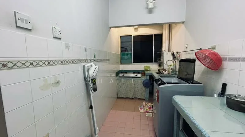 Kitchen features: white tiled walls, pink tiled flooring, single-bowl stainless-steel sink, chrome pull-down faucet, window above sink, white cabinetry, stainless-steel refrigerator, freestanding washing machine, countertop with rounded edges, plastic dish rack, red colander, cleaning mop, decorative wall trim.