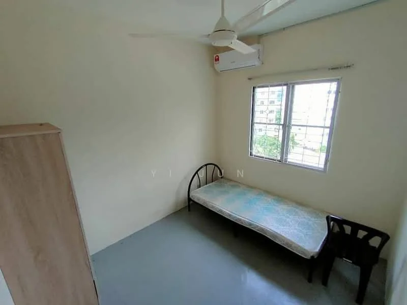 Bedroom features: single bed, ceiling fan, wall-mounted split AC, window with view of greenery, light-colored walls, grey flooring, wooden wardrobe, black plastic chair; view: garden.