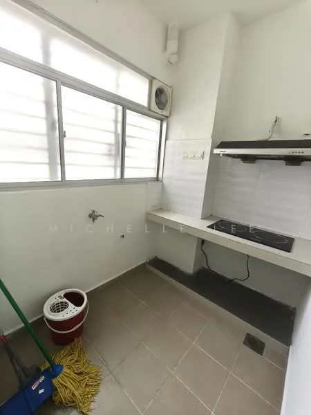 Room features: white painted walls, grey tiled flooring, single-bowl stainless-steel sink, wall-mounted range hood, countertop with backsplash, window with horizontal slats, floor drain, mop and bucket, air conditioning unit.