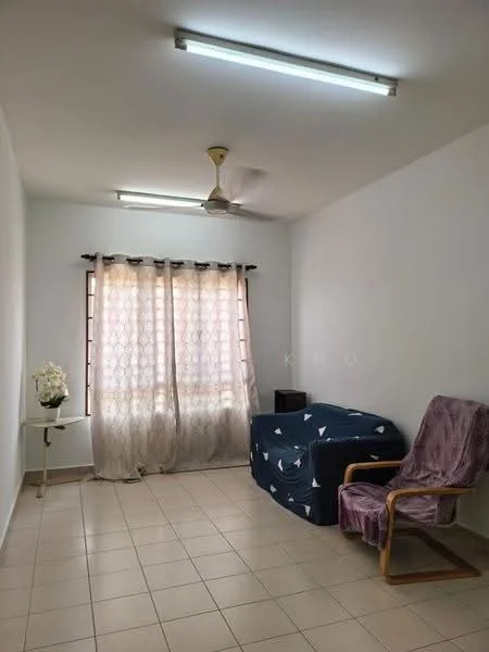 Bedroom features: white painted walls, tile flooring, ceiling fan, window with sheer curtains, single bed with blue bedding, wooden rocking chair, small side table, decorative flower arrangement.