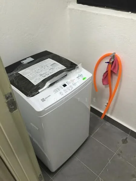 Laundry features: top-load washing machine in white, grey tiled flooring, white painted walls, window for natural light, hose for drainage, hanging rack for drying.