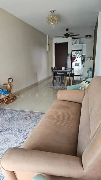Living features: beige fabric sofa, area rug with geometric pattern, chandelier, ceiling fan, wall-mounted TV, dining table with chairs, refrigerator, light-colored walls, tile flooring, decorative wall art, rocking chair; style: modern.
