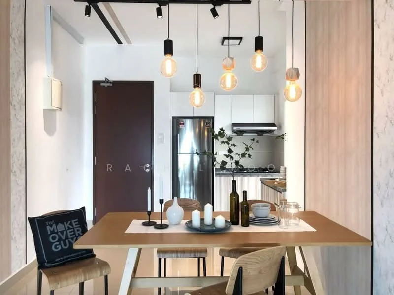 Dining features: wooden dining table, 4 wooden dining chairs, pendant lighting with exposed bulbs, white walls with wood paneling, kitchen visible in background, stainless-steel fridge, stainless-steel range hood, gas stove, decorative plants, table setting with candles and vases; style: modern.