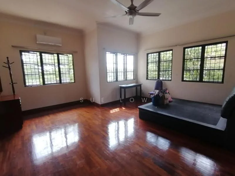 Living features: wooden flooring, white painted walls, ceiling fan, floor-to-ceiling windows, black platform area, small table, natural light from windows, decorative items on platform.