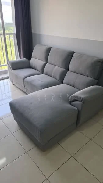 Living features: L-shape sectional sofa in grey fabric, floor-to-ceiling windows, curtains, white painted walls, light-colored tile flooring, natural light from window, view of greenery outside; style: modern; view: garden.
