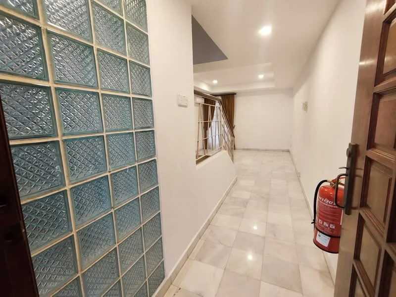 Room features: glass block wall, white painted walls, marble flooring, recessed downlights, fire extinguisher, staircase, curtains, open space; style: modern.