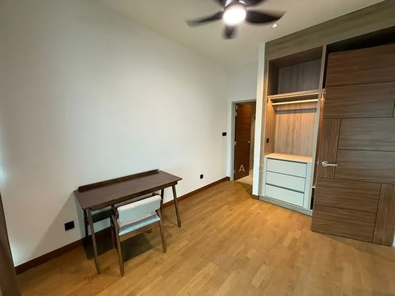 Study features: wooden flooring, white painted walls, ceiling fan, built-in wardrobe with wood finish, desk with wooden legs, upholstered chair, door leading to hallway; style: modern.
