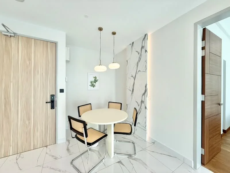 Dining features: round dining table, 4 dining chairs with black frames and beige upholstery, white marble flooring, white walls, wooden door, modern pendant lights, decorative wall with marble pattern, wall-mounted artwork; style: modern.