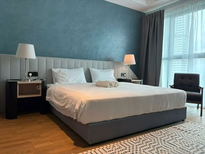 Bedroom features: king-size bed, upholstered headboard, white bedding, 2 bedside lamps, wooden nightstands, grey upholstered bed frame, wooden flooring, decorative area rug, floor-to-ceiling windows with sheer curtains, accent wall in teal, armchair in dark fabric; style: modern; view: city.