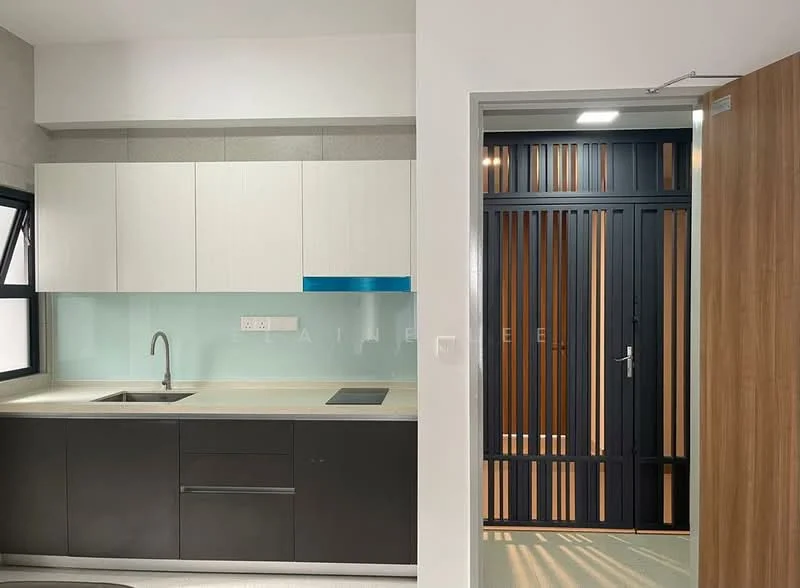 Kitchen features: black lower cabinetry, white upper cabinetry, glass backsplash, single-bowl stainless-steel sink, chrome pull-down faucet, built-in cooktop, countertop with integrated sink, recessed downlights; style: modern. Room features: wooden door with vertical slats, light-colored wall, grey flooring.