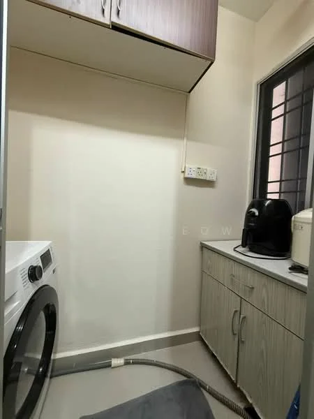 Laundry features: front-load washing machine, wooden cabinetry, grey laminate countertop, white walls, tile flooring, window with black frame, black appliance (possibly a kettle or coffee machine), plumbing hose, light fixture; style: modern.