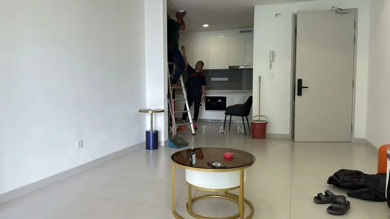 Living features: white painted walls, light grey floor tiles, recessed downlights, ceiling with no visible crown moulding, coffee table with round glass top, black chair, ladder, bucket, sliding door, open kitchen area visible, no visible decor, no visible appliances; style: modern.