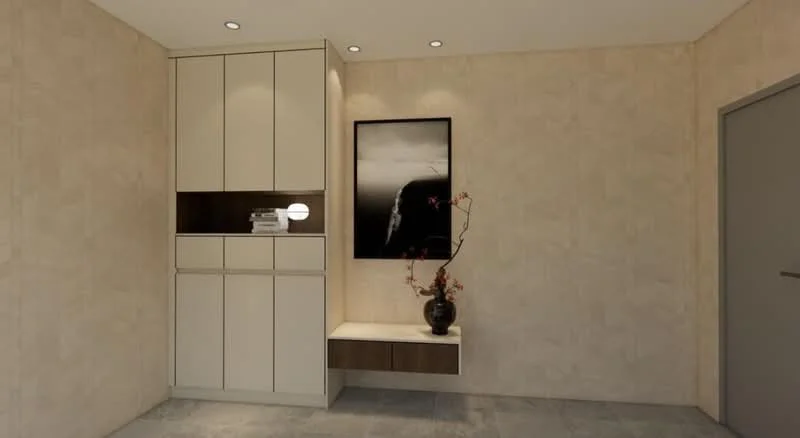 Room features: light beige textured walls, grey tile flooring, built-in cabinetry with cream finish, dark wood accent shelf, framed black and white artwork, decorative vase with branches, recessed ceiling lights, single-panel door with handle; style: modern.