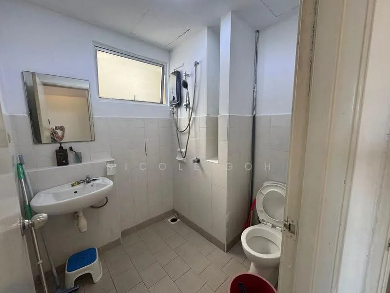 Bathroom features: white tiled walls, light grey tiled flooring, single-sink vanity with mirror, chrome basin mixer faucet, toilet, shower with handheld showerhead, window for natural light, wall-mounted soap dispenser.