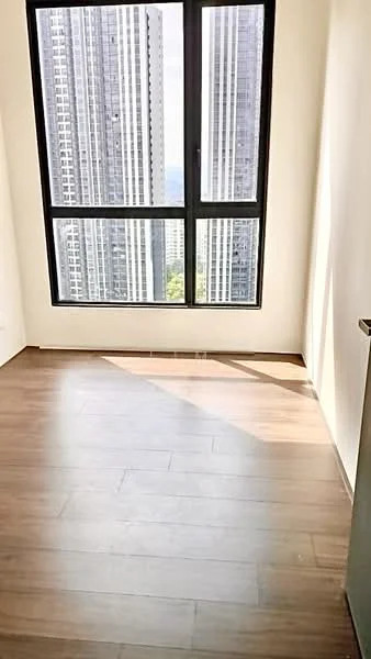 Room features: wooden flooring, large floor-to-ceiling window, city skyline view, neutral wall color, corner room with natural light; style: modern; view: city.