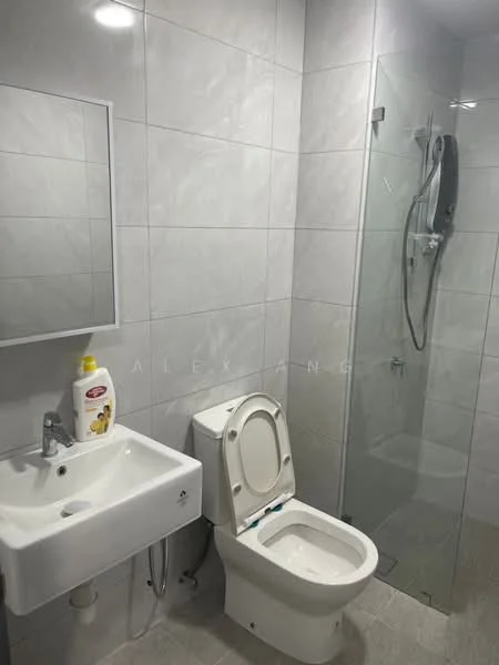 Bathroom features: white tiled walls, grey tiled flooring, single-sink vanity with wall-mounted faucet, framed mirror, one-piece toilet, walk-in shower with glass enclosure, chrome shower head, shower mixer, toiletries on sink, towel rack; style: modern.