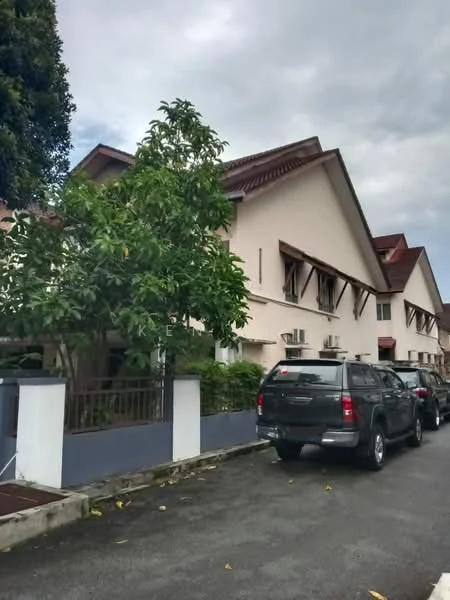 Exterior type: linked terrace house; features: two-storey building, cream painted facade, red pitched tile roof, front garden with tree, multiple air conditioning units visible, driveway with parked vehicles, manicured landscaping, surrounded by residential area; style: modern.