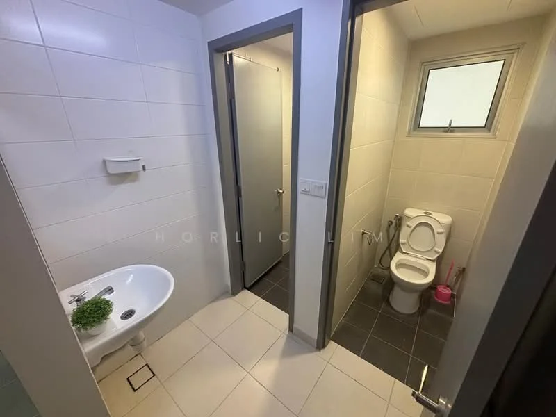 Bathroom features: white tiled walls, grey tiled flooring, single-sink vanity with wall-mounted faucet, toilet, framed mirror, window for natural light, plant decoration, door to adjacent room; style: modern.