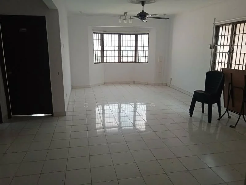 Living features: white painted walls, glossy white tile flooring, ceiling fan, large windows with grid pattern, natural light, empty space, one black chair, one stacked chair, corner wall with door, no visible decor.
