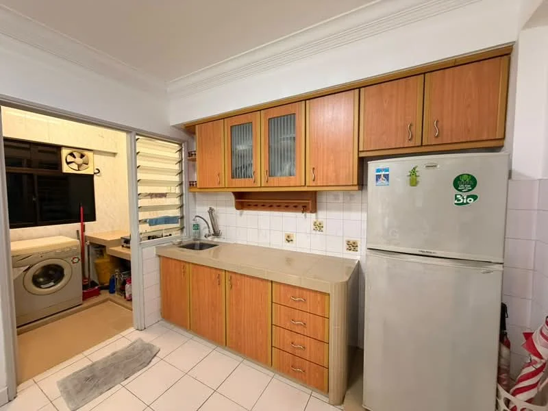Kitchen features: wood cabinetry with glass-front upper cabinets, granite countertop, single-bowl stainless-steel sink, chrome pull-down faucet, stainless-steel fridge, built-in washing machine, tile backsplash, white tiled flooring, wall-mounted shelves, window with louvered shutters, light fixture, kitchen island, open layout to adjacent laundry area; style: modern.