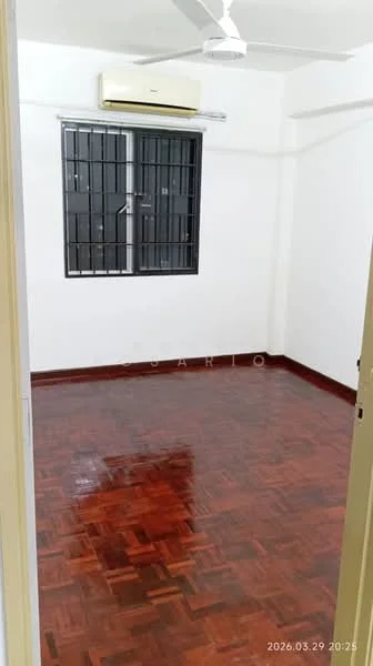 Room features: wooden flooring, white painted walls, ceiling fan, window with black metal grille, air conditioning unit, no visible furniture.