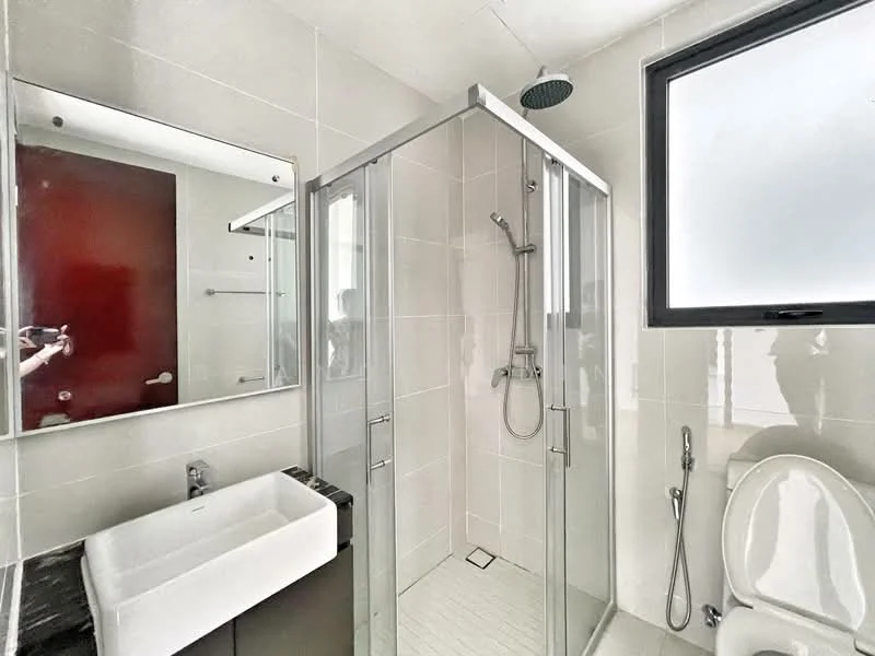 Bathroom features: glass shower enclosure, rain shower head, handheld shower, white ceramic sink, black countertop, single-sink vanity with storage, one-piece toilet, framed mirror, tile flooring, white tiled walls, window for natural light; style: modern.