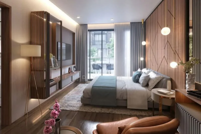 Bedroom features: king-size bed with grey bedding, upholstered headboard, wooden flooring, wood panel accent wall, floor-to-ceiling windows, sheer curtains, recessed downlights, pendant lighting, TV mounted on wall, side table with lamp, decorative vase with flowers, area rug with geometric pattern, armchair in brown leather, wall-mounted shelving unit; style: modern; view: garden.
