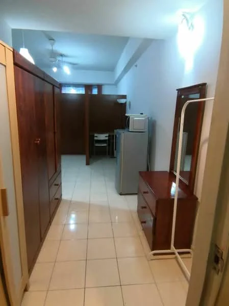 Room features: white painted walls, tile flooring, ceiling lights, 2 ceiling fans, wooden wardrobe with drawers, wooden dresser, microwave, refrigerator, dining table with chairs, open space layout; style: modern.