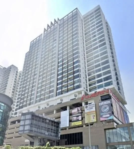 Exterior type: high-rise condominium; features: glass curtain wall, white painted facade, projecting balconies, signage on building, multiple storeys, commercial space at ground level, surrounded by urban context; style: modern.