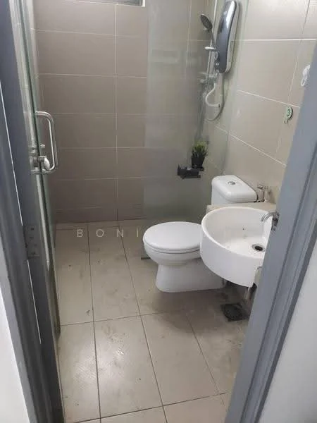 Bathroom features: white toilet, single-sink vanity with wall-mounted faucet, shower with handheld shower head, glass shower enclosure, light beige tile walls, light beige tile flooring, small plant on shelf, mirror above sink; style: modern.