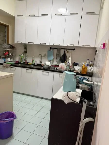 Kitchen features: white upper cabinets with handle-less design, black countertop, stainless-steel sink, chrome pull-down faucet, ceramic tile flooring in light green, kitchen appliances including kettle and blender, open shelving, various bottles and containers on countertop, purple trash bin, dish drying rack, hanging utensils, wall-mounted hooks; style: modern.