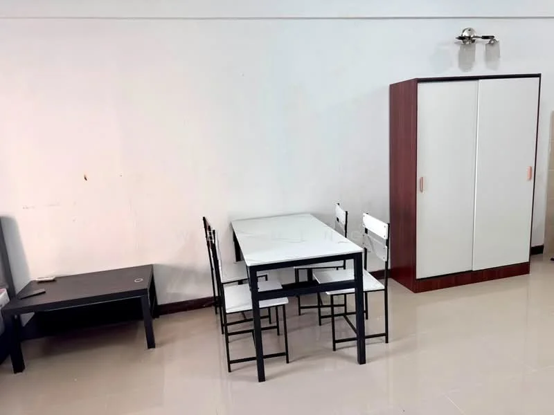 Room features: white dining table, 4 black dining chairs, black coffee table, wooden wardrobe with white doors, cream tiled flooring, wall-mounted light fixture, plain white walls; style: minimalist.