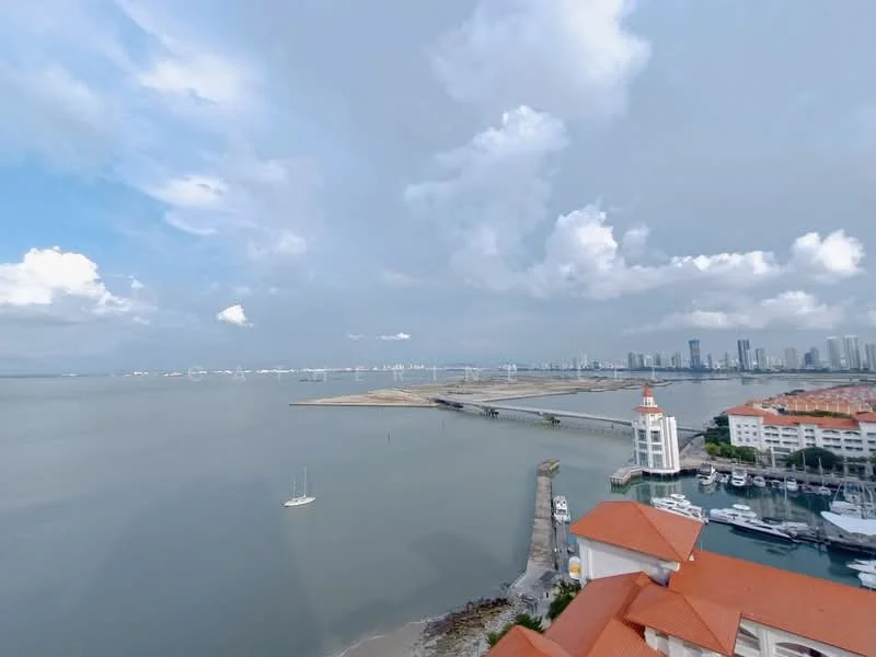 Exterior features: waterfront view, city skyline in background, marina with boats, pier extending into water, cloudy sky, red-tiled roofs, landscape with sandy area; style: modern.