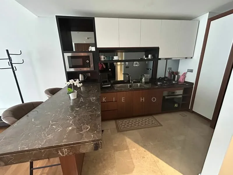 Kitchen features: marble countertop, wood cabinetry, stainless-steel sink, chrome pull-down faucet, built-in microwave, stainless-steel gas hob, exhaust hood, kitchen island with seating, ceramic tile flooring, wall-mounted shelving, recessed downlights; style: modern.