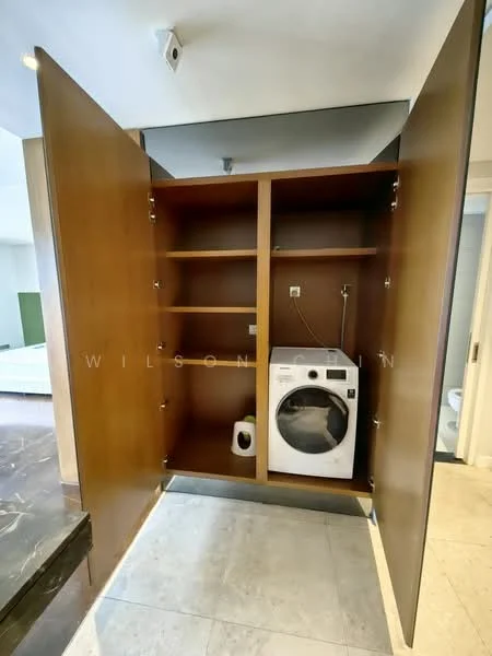 Laundry features: built-in cabinetry, wooden cabinet doors, shelves for storage, front-load washing machine, plumbing connection, neutral tile flooring, light-colored walls, recessed lighting; style: modern.