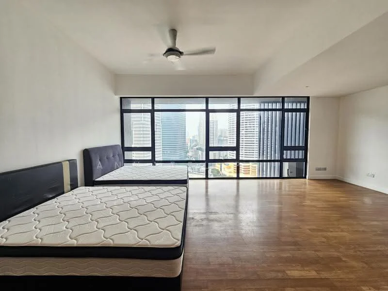 Bedroom features: large floor-to-ceiling windows, city skyline view, wooden flooring, white painted walls, ceiling fan, two queen-size beds, no visible closet, minimalist decor; style: modern; view: city.
