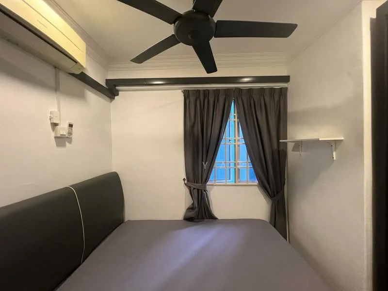 Bedroom features: queen-size bed, grey bedding, 5-blade ceiling fan, wall-mounted air conditioning unit, white painted walls, dark curtains, window with grid pattern, shelf mounted on wall; style: modern.