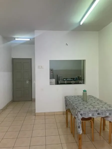 Dining features: table with tablecloth, four wooden chairs, white walls, tile flooring, ceiling lights, open view to kitchen, doorway to hallway. Room features: grey door, kitchen visible in background.