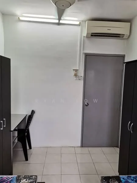 Room features: white painted walls, tile flooring, 1 wall-mounted split AC, ceiling fan, black desk, black chair, grey door, built-in cabinets.