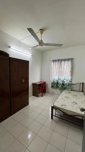 Bedroom features: single bed with mattress, wooden wardrobe, study desk, red plastic chair, white walls, ceiling fan with light, tile flooring, curtains with floral pattern, window with natural light.