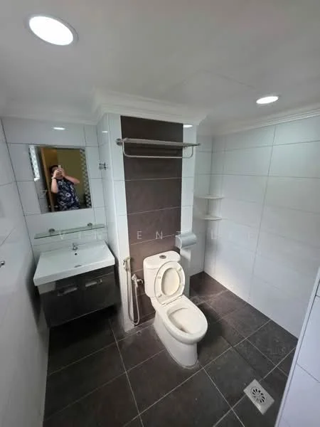 Bathroom features: white tiled walls, dark grey tiled flooring, single-sink vanity with cabinet, chrome basin mixer faucet, framed mirror, one-piece toilet, shower area with wall-mounted showerhead, towel rack, built-in shelving, ventilation window; style: modern.