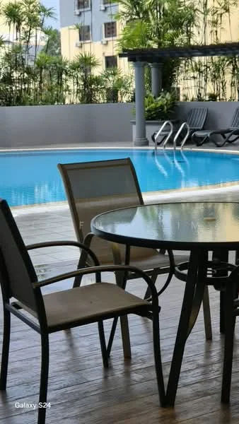 Exterior type: swimming pool deck; features: infinity pool, pool deck with loungers, wooden decking, surrounding greenery, outdoor dining table, metal chairs, potted plants; style: modern.