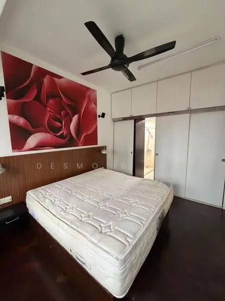 Bedroom features: queen-size bed, black ceiling fan, wood paneling on one wall, white painted walls, built-in wardrobe with sliding doors, dark wood flooring, decorative wall art with rose design, two bedside lamps; style: modern.
