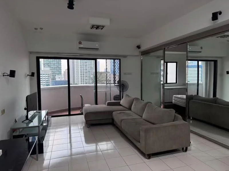 Living features: grey L-shape sectional sofa, glass coffee table, wall-mounted TV, TV console, floor-to-ceiling windows, sliding glass door, white painted walls, white tiled flooring, 1 wall-mounted split AC, ceiling fan, mirrored wall, decorative wall sconce; style: modern; view: city.