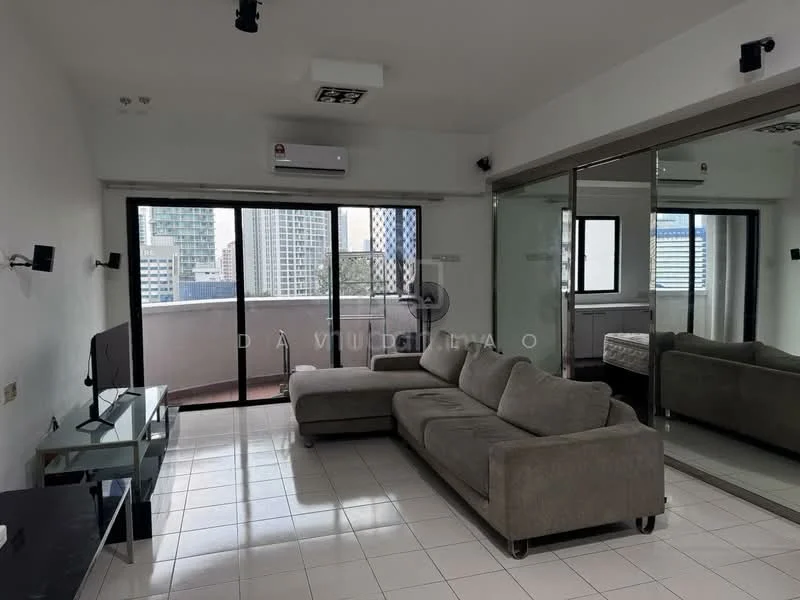 Living features: light grey fabric sectional sofa, glass coffee table, wall-mounted TV, floor-to-ceiling windows, sliding glass door, white painted walls, tile flooring, 1 wall-mounted split AC, mirrored wall, recessed downlights; style: modern; view: city.