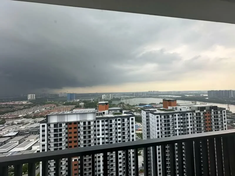 Exterior type: high-rise condominium; features: city skyline view, multiple high-rise buildings, balcony with railing, cloudy sky, water body visible, urban landscape, surrounding residential area; style: modern.