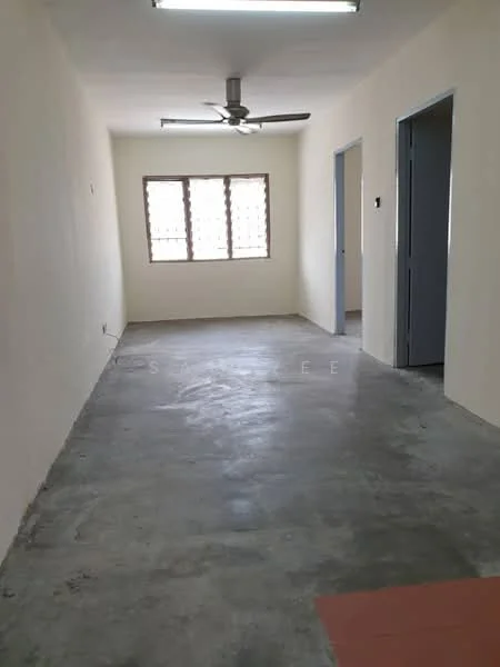Room features: concrete flooring, white painted walls, ceiling fan, window with grid pattern, two doorways, fluorescent ceiling lights.